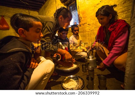 KATHMANDU, NEPAL - DEC 9, 2013: Unknown children during dinner at Jagadguru School. School established at 2013, to let new generation learn Sanskrit and preserve Hindu culture.
