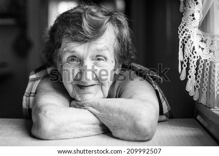 Portrait of a smiling old woman (black and white photo)