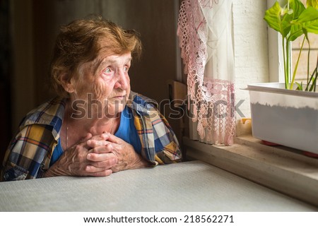 Similar – Image, Stock Photo Senior woman sitting alone on the sofa at home