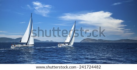 Panorama of the yacht race in the open sea. Sailing. Luxury yachts.