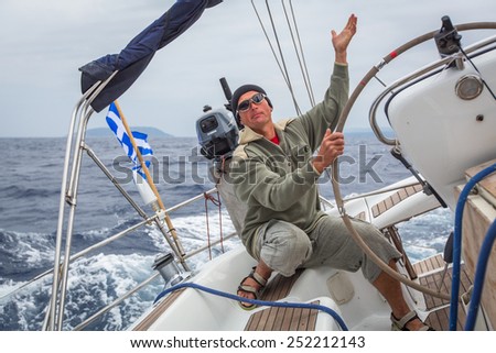 HYDRA, GREECE - CIRCA OCT, 2014: Unidentified sailors participate in sailing regatta 12th Ellada Autumn 2014 among Greek island group in the Aegean Sea, in Cyclades and Argo-Saronic Gulf.