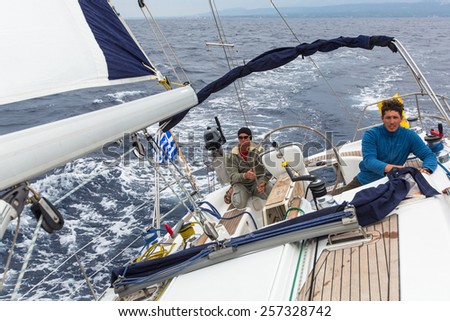 HYDRA, GREECE - CIRCA OCT, 2014: Unidentified sailors participate in sailing regatta 12th Ellada Autumn 2014 among Greek island group in the Aegean Sea, in Cyclades and Argo-Saronic Gulf.