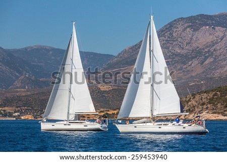 TRIZONIA, GREECE - CIRCA OCT, 2014: Unidentified sailors participate in sailing regatta 12th Ellada Autumn 2014 among Greek island group in the Aegean Sea, in Cyclades and Argo-Saronic Gulf.