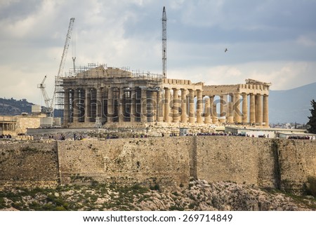 ATHENS, GREECE - APR 7, 2015: Parthenon temple on the Acropolis hill. Parthenon is a former temple on the Athenian Acropolis, dedicated to the goddess Athena. Construction began in 447 BC.