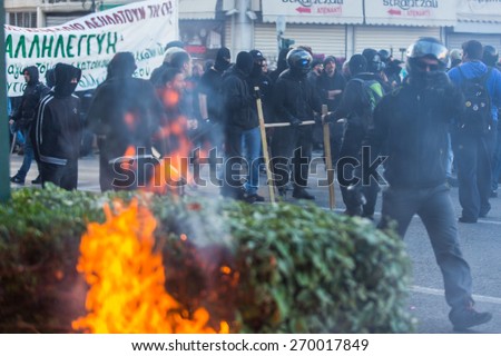 ATHENS, GREECE - APR 16, 2015: Leftist and anarchist groups seeking the abolition of new maximum security prisons, clashed with riot police, who responded with tear gas and stun grenades.