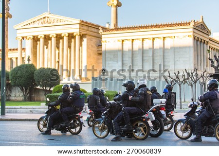 ATHENS, GREECE - APR 16, 2015: Riot police on motorcycles during a rally in front of the Athens University, which is under occupation by the protesters and leftist anarchist groups.