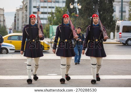 ATHENS, GREECE - APR 14, 2015: Greek soldiers Evzones (or Evzoni) dressed in service uniform, refers to the members of the Presidential Guard, an elite ceremonial unit, active from 1833 - present.