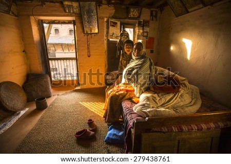 BHAKTAPUR, NEPAL - CIRCA DEC, 2013: Unidentified poor people in his house. The caste system is still intact today but the rules are not as rigid as they were in the past.