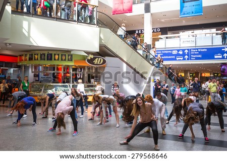 KRAKOW, POLAND - MAY 16, 2015: Unidentified participants in a dance flash mob at the Central city train station.