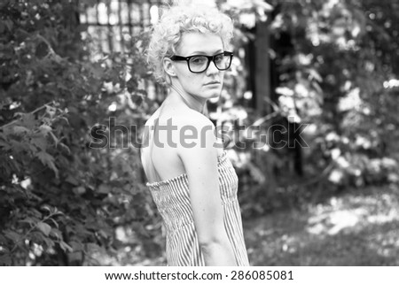 Beautiful girl on the park. Black and white photography.