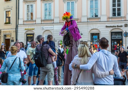 KRAKOW, POLAND - JUL 11, 2015: Unidentified participants at the 28th International Festival of Street Theatres. Annually July 9-12 performances in the Main Square and at random points around the city.