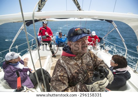 ANDROS - SYROS, GREECE - CIRCA MAY, 2014: Sailors participate in sailing regatta 11th Ellada 2014 among Greek island group in the Aegean Sea, in Cyclades and Argo-Saronic Gulf.