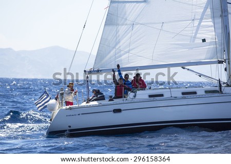 ANDROS - SYROS, GREECE - CIRCA MAY, 2014: Sailors participate in sailing regatta 11th Ellada 2014 among Greek island group in the Aegean Sea, in Cyclades and Argo-Saronic Gulf.