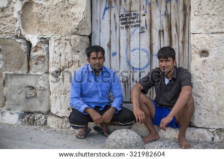 KOS, GREECE - SEP 28, 2015: Unidentified refugees. Kos island is located just 4 kilometers from the Turkish coast, and many refugees come from Turkey in an inflatable boats.