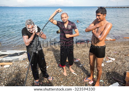 KOS, GREECE - SEP 27, 2015: Unidentified refugees. More than half are migrants from Syria, but there are refugees from other countries - Afghanistan, Pakistan, Iraq, Iran, Mali, Bangladesh, Eritrea.