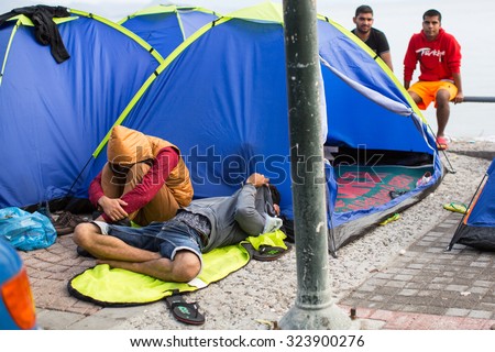 KOS, GREECE - SEP 28, 2015: Unidentified refugees. More than half are migrants from Syria, but there are refugees from other countries - Afghanistan, Pakistan, Iraq, Iran, Mali, Bangladesh, Eritrea.