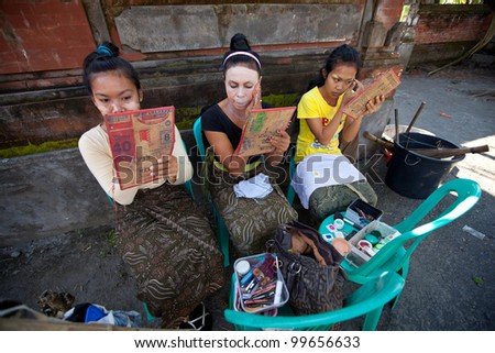 BALI, INDONESIA - APRIL 9: Balinese girls preparing for a classic national Balinese dance Barong on April 9, 2012 on Bali, Indonesia. Barong is very popular cultural show on Bali.