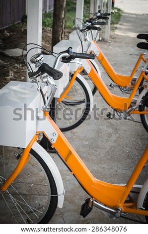 Chiang Mai 2015 public hire bike along with Barclays Bikes locked at the docking bays.