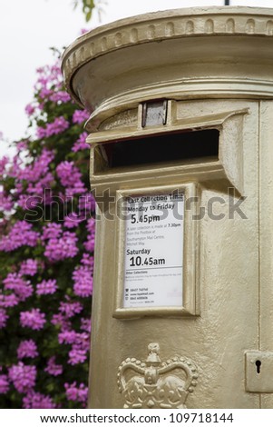HAMBLE, NR SOUTHAMPTON, UK - AUG 8:UK's Royal Mail honors Olympic Gold Medal winners, by transforming a post box from red to gold in the home town of each gold medalist on Aug 8,2012 in Hamble, UK.