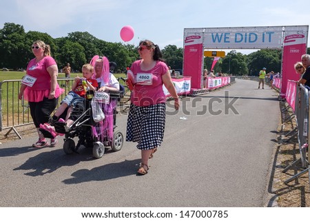 SOUTHAMPTON, UK - JULY 14: Women and unidentified children gather for the annual Race for Life to raise money for Cancer Research on July 14, 2013 in Southhampton, UK.