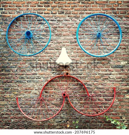 Old bike parts creating a face. Street scene, Amsterdam