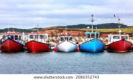 A row of colour fishing boats in the harbour of Havre Aubert, Magdalen Islands, Canada. The primary industry of the Islands is its fisheries. Stock fotó © 