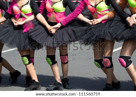 AURILLAC, FRANCE - AUGUST 22 :Group of dancers wearing a black tutu as part of the Aurillac International Street Theater Festival, Ballets Temps Dance Jr Cie , on august 22, 2012, in Aurillac,France.