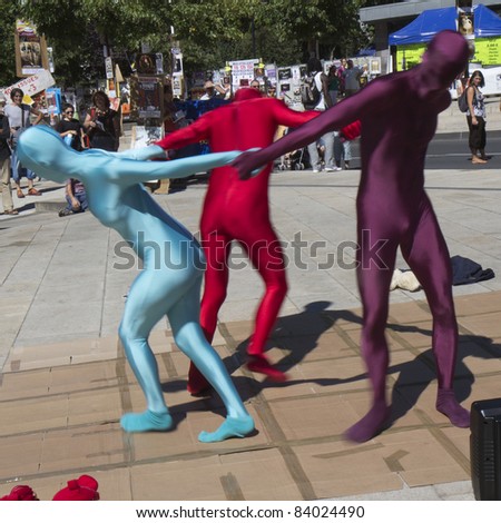 AURILLAC, FRANCE- AUGUST 17:  Unidentified strange dancers move in the street as part of the Aurillac International Street Theater Festival, Cie \
