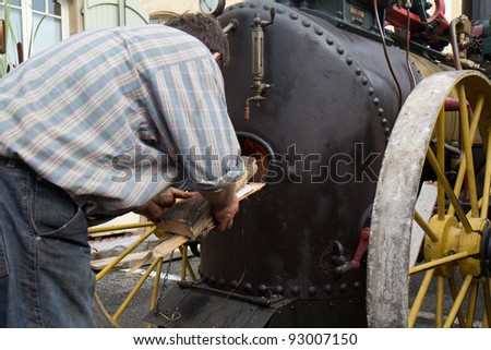 SEISSAN, FRANCE - AUGUST 5:  Logs are put in a steam machine boiler at 