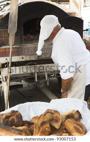 SEISSAN, FRANCE - AUGUST 5:  Baker at work to make  typical breads at \