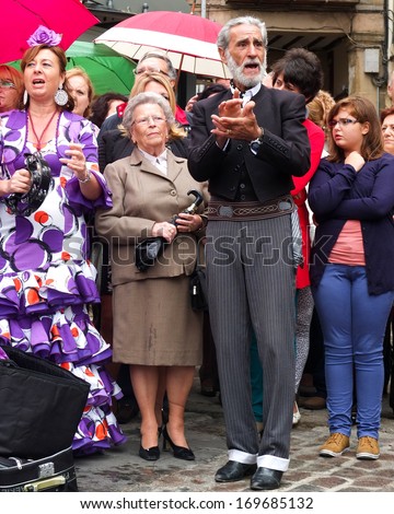 UBEDA, SPAIN -  SEPTEMBER 29: a man is singing in the middle of the crowd during the celebrations of the San Miguel, on September 29, 2013, in Ubeda, Spain.