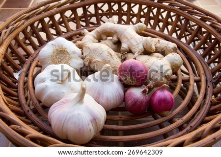basket of Thai ingredient with garlic , ginger and shallot