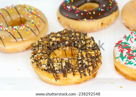 Set of colorful and delicious donut in paper box