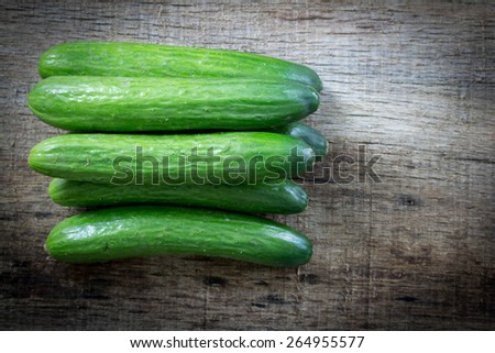 Cucumbers on a wooden background.
