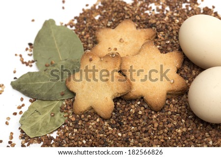 Chicken eggs on buckwheat spilling with cookies. Ingredients.