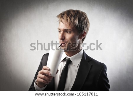 Young businessman having a drink