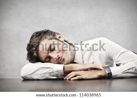 Man sleeping on a desk