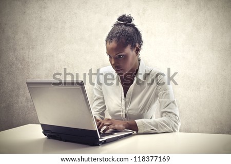 Black woman using a laptop computer