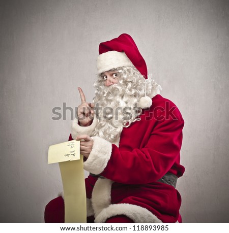 Santa Claus checking the gift list