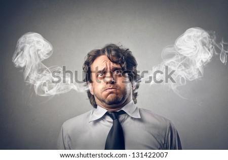 stock-photo-furious-businessman-with-smo
