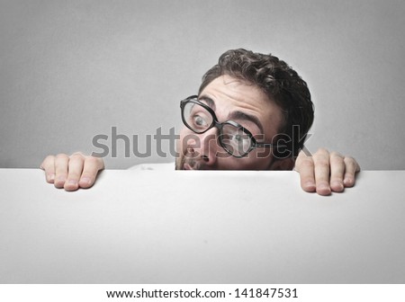 man with glasses who has a lot of fear