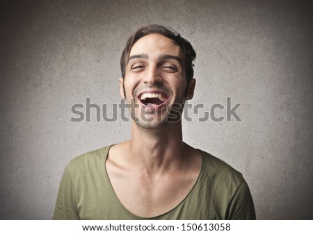 handsome man laughs
