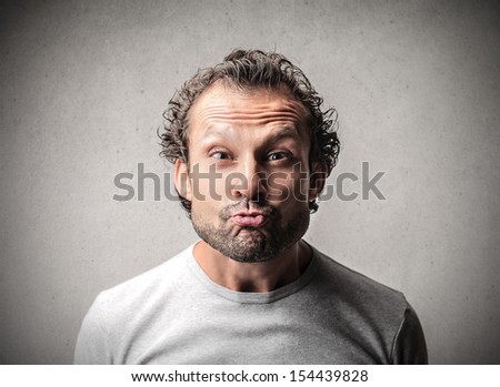 portrait of a man who makes funny faces