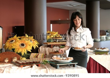 a pretty girl with breakfast in hotel