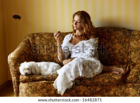 a woman and a dog on a sofa