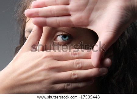 young attractive woman framing her hands