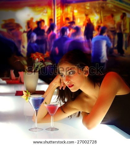 woman drinking cocktail during a party