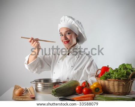 female cook sampling genuine food
