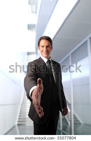business man with open hand ready to seal a deal