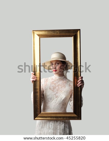 Portrait of a beautiful woman holding a frame